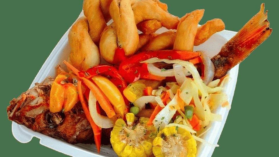 Menu board with Caribbean dishes and seafood options.